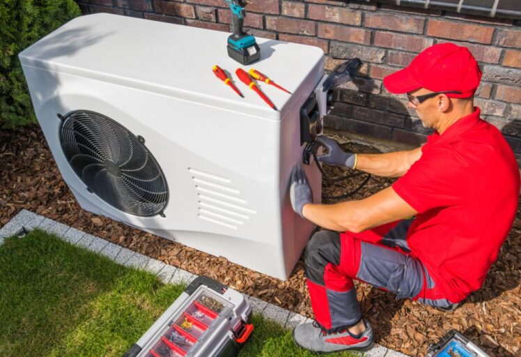 HVAC Technician working on an air conditioner