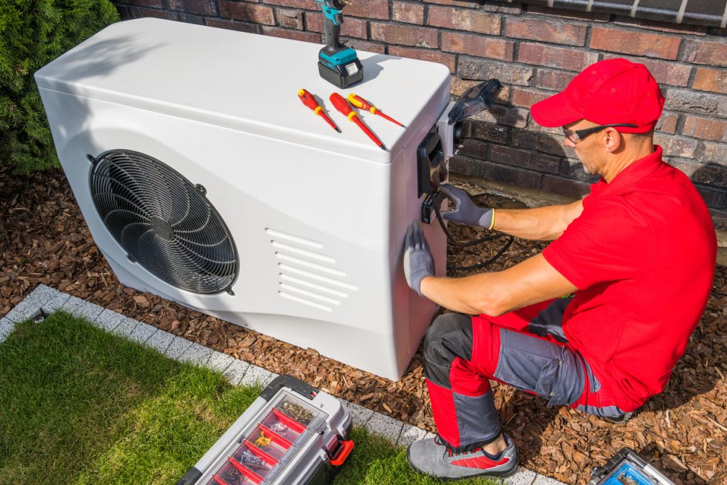 HVAC Technician working on an air conditioner
