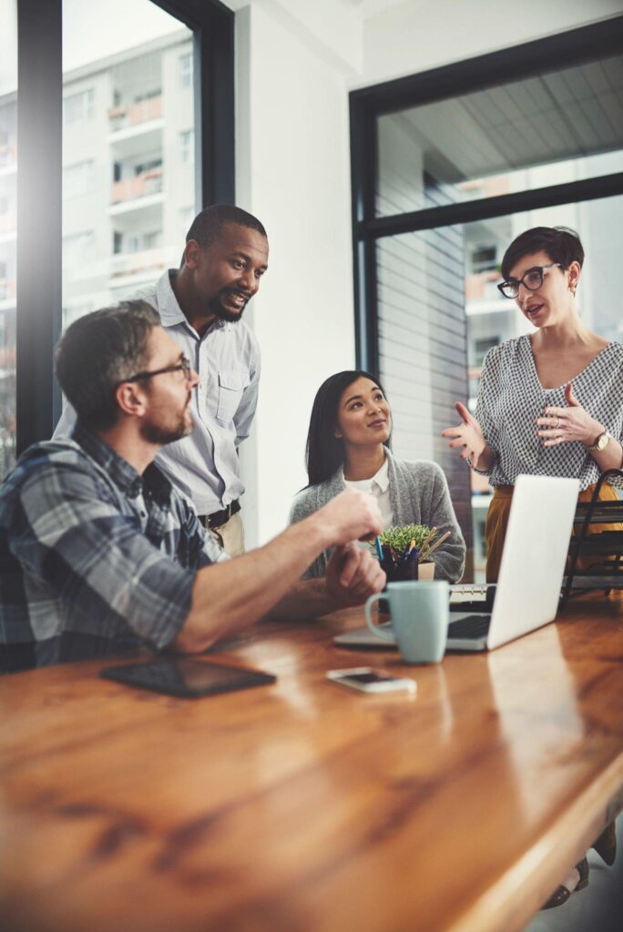 Group of people having a meeting in a bright office space.